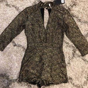 Gold and black romper with skort front